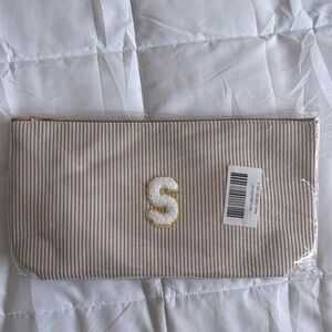 Striped Tan Pouch with Initial “S” new with tags never opened or used